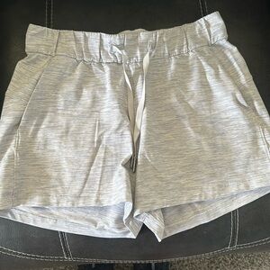 Lululemon grey/ white striped shorts. Elastic waist w/draw string. PocketsSize 4